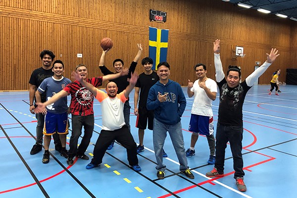 A group of seafarers standing in a sports hall