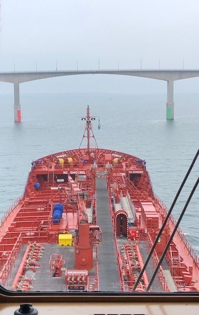 Tanker on its way under bridge