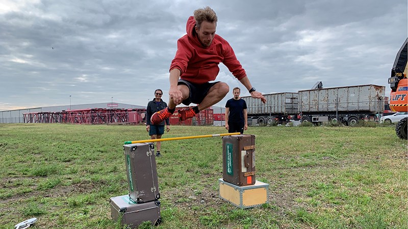 A seafarer making a standing high jump